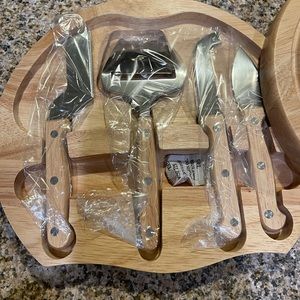 Brand New Wooden Cheese board with 4 different cheese cutters. Great for party.